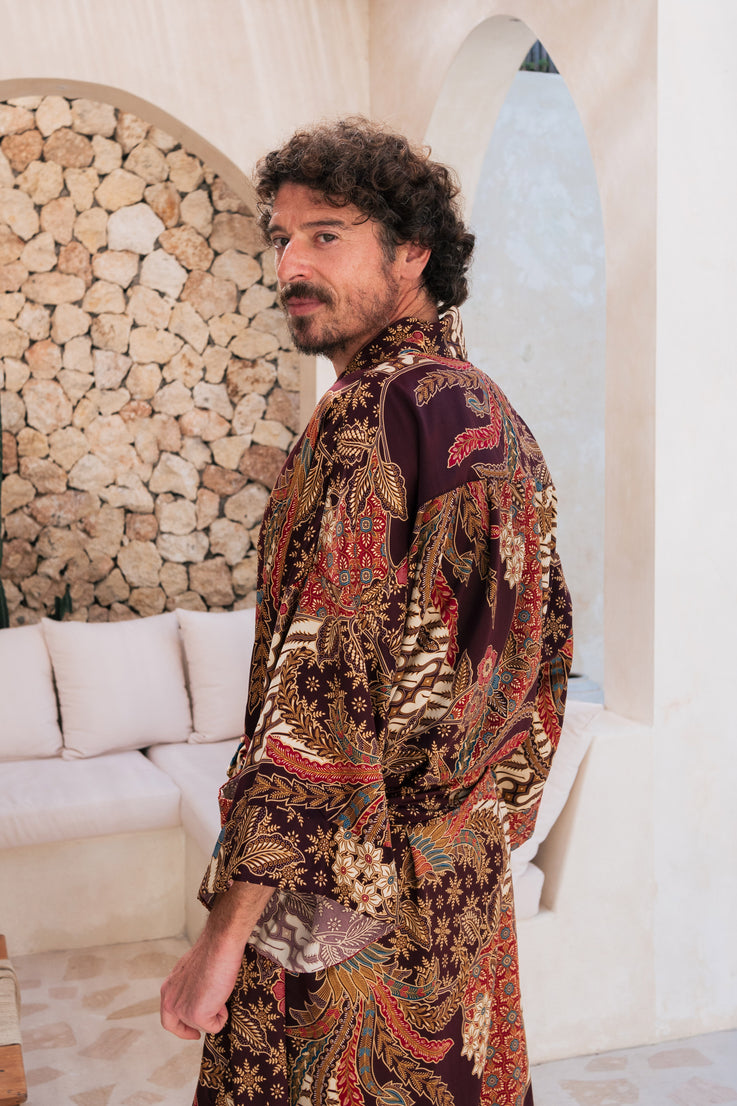 A man wearing burgundy Silk Kimono Robe handmade in Bali