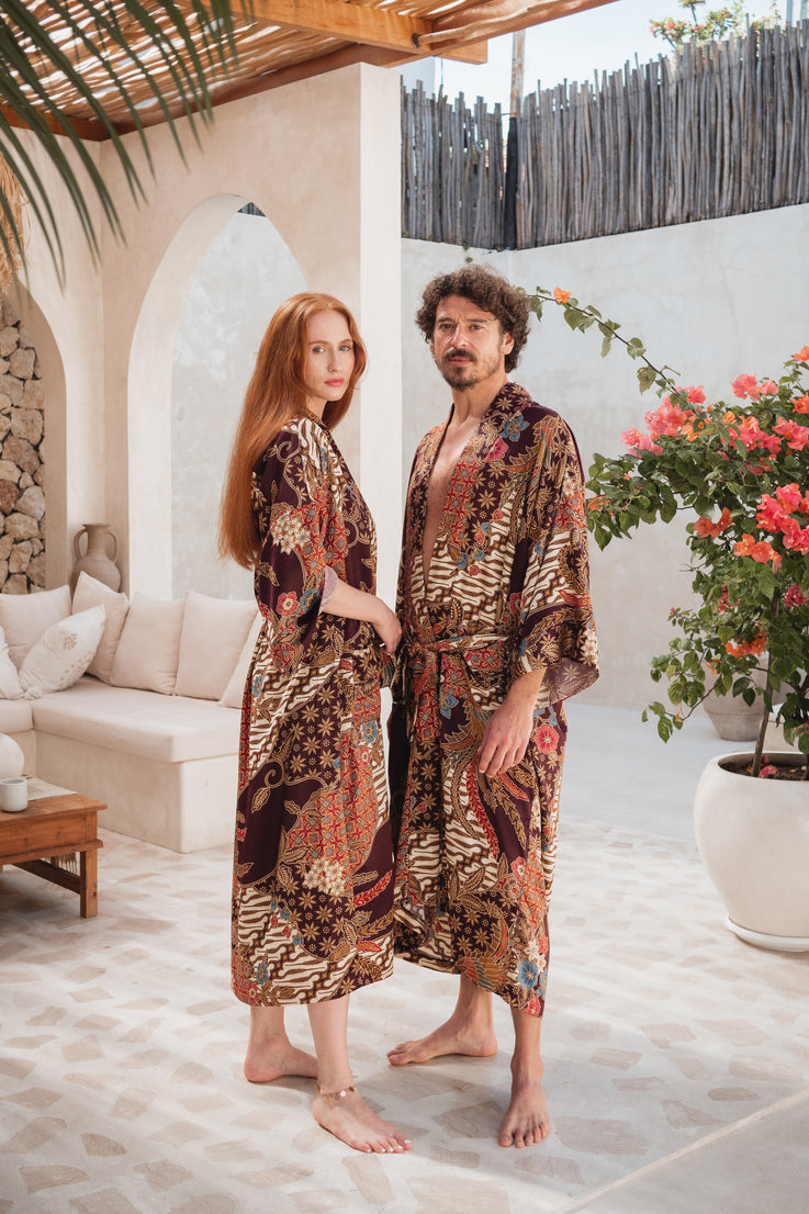a couple wearing unisex burgungy bali silk kimono robe