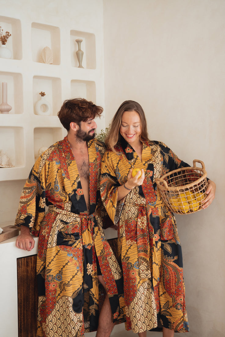 couple wearing Balinese orange/yellow/black Silk Kimono Robe