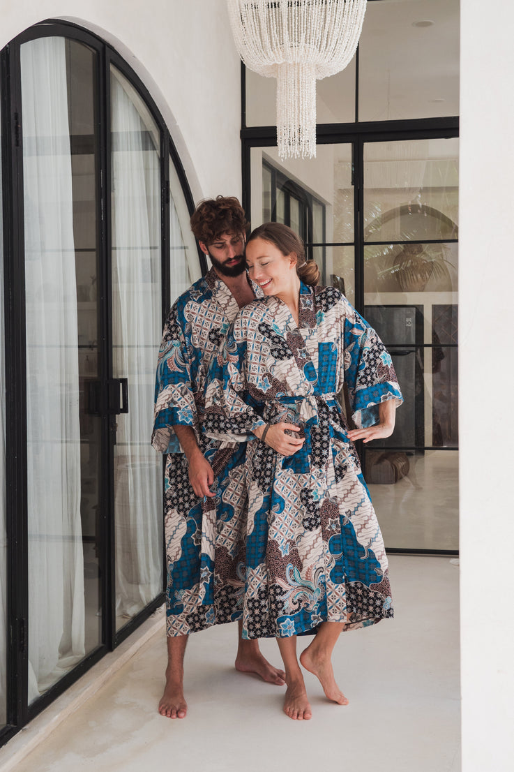 a man and a woman wearing blue and white floral balinese silk kimono robe