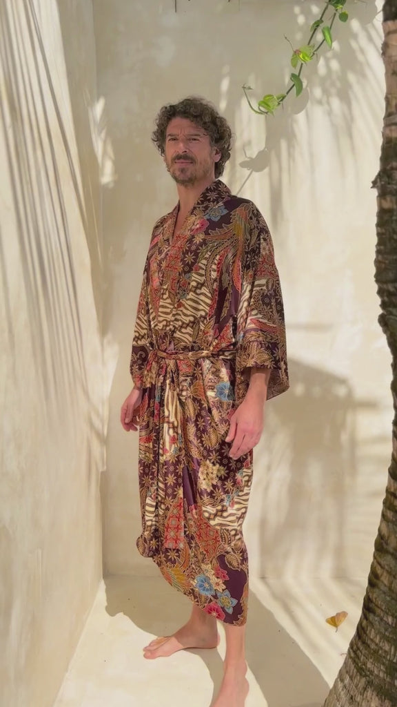 A man wearing burgundy Silk Kimono Robe handmade in Bali